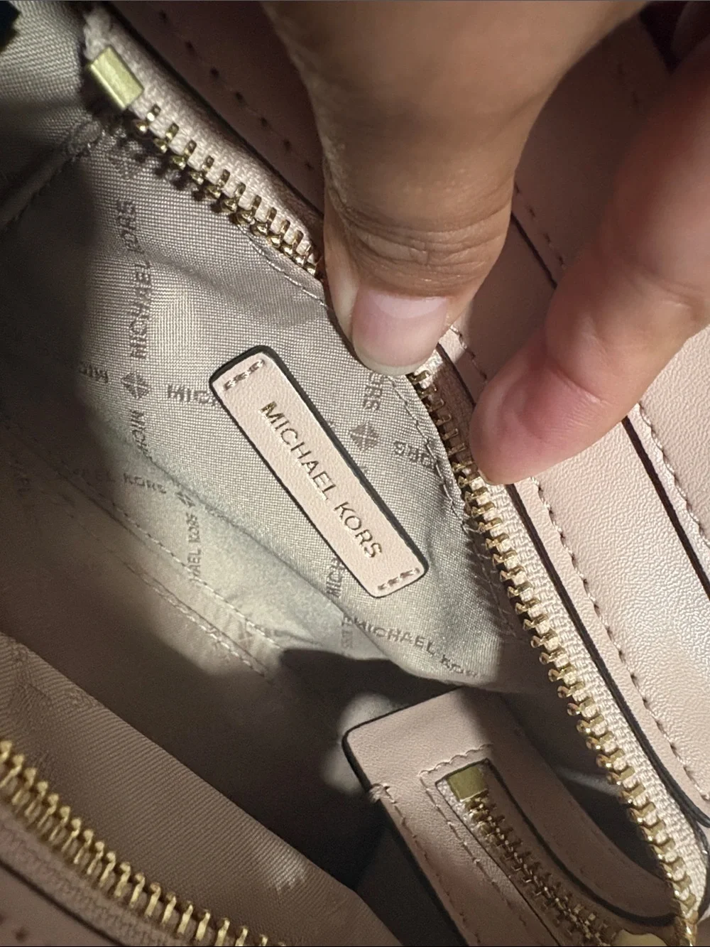 A cute MICHAEL KORS Blush Pink Logo Satchel with Floral Charm